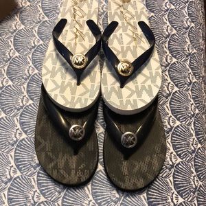 Micheal Kors Flip flops. Two pair set. Black/black and navy/white